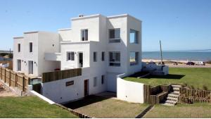 Ocean-View House Excellent Location located in La Barra, Punta del Este, Uruguay, listed by Curiocity Villas.